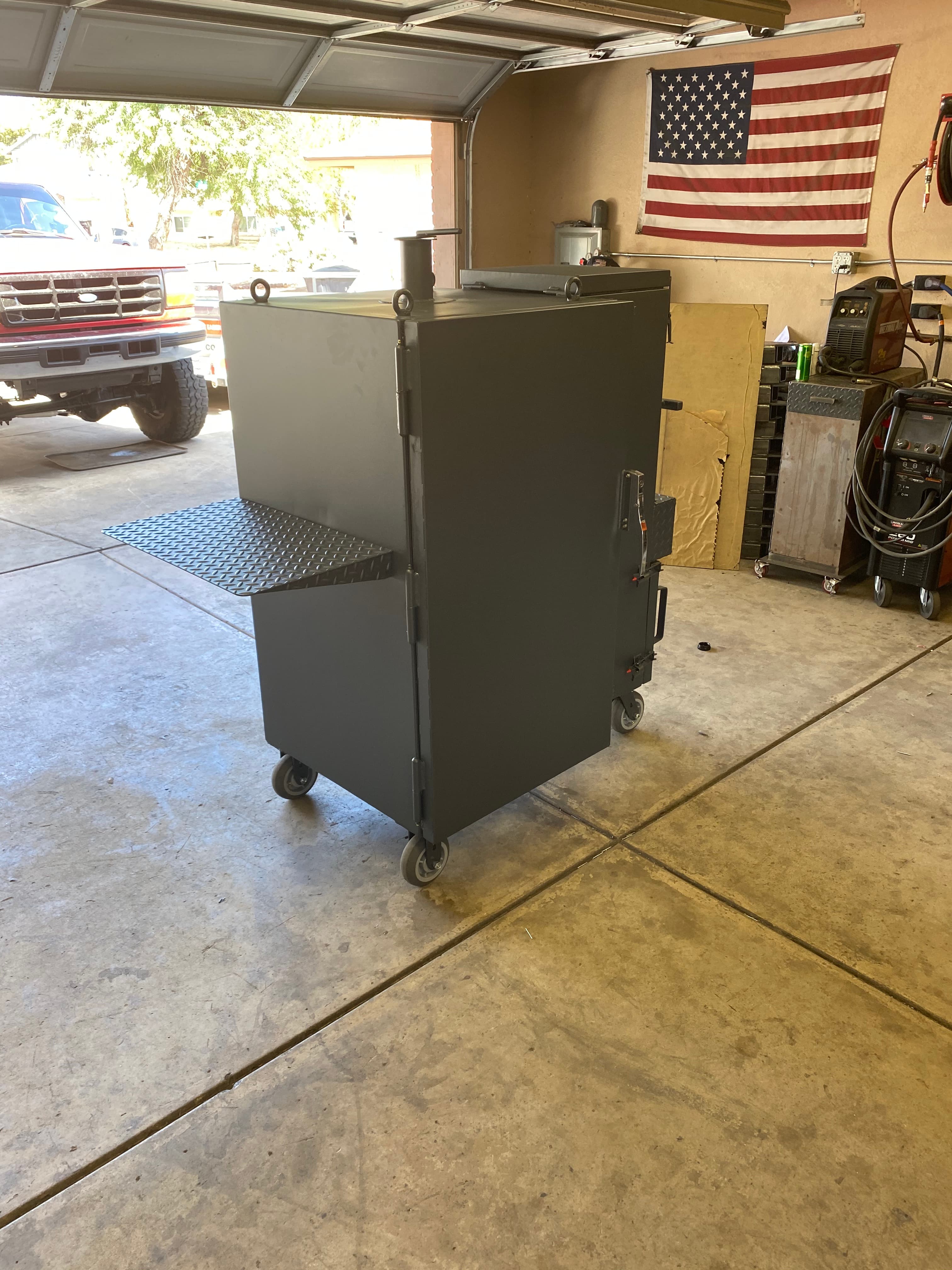 Custom smoker with side firebox design, fresh paint job