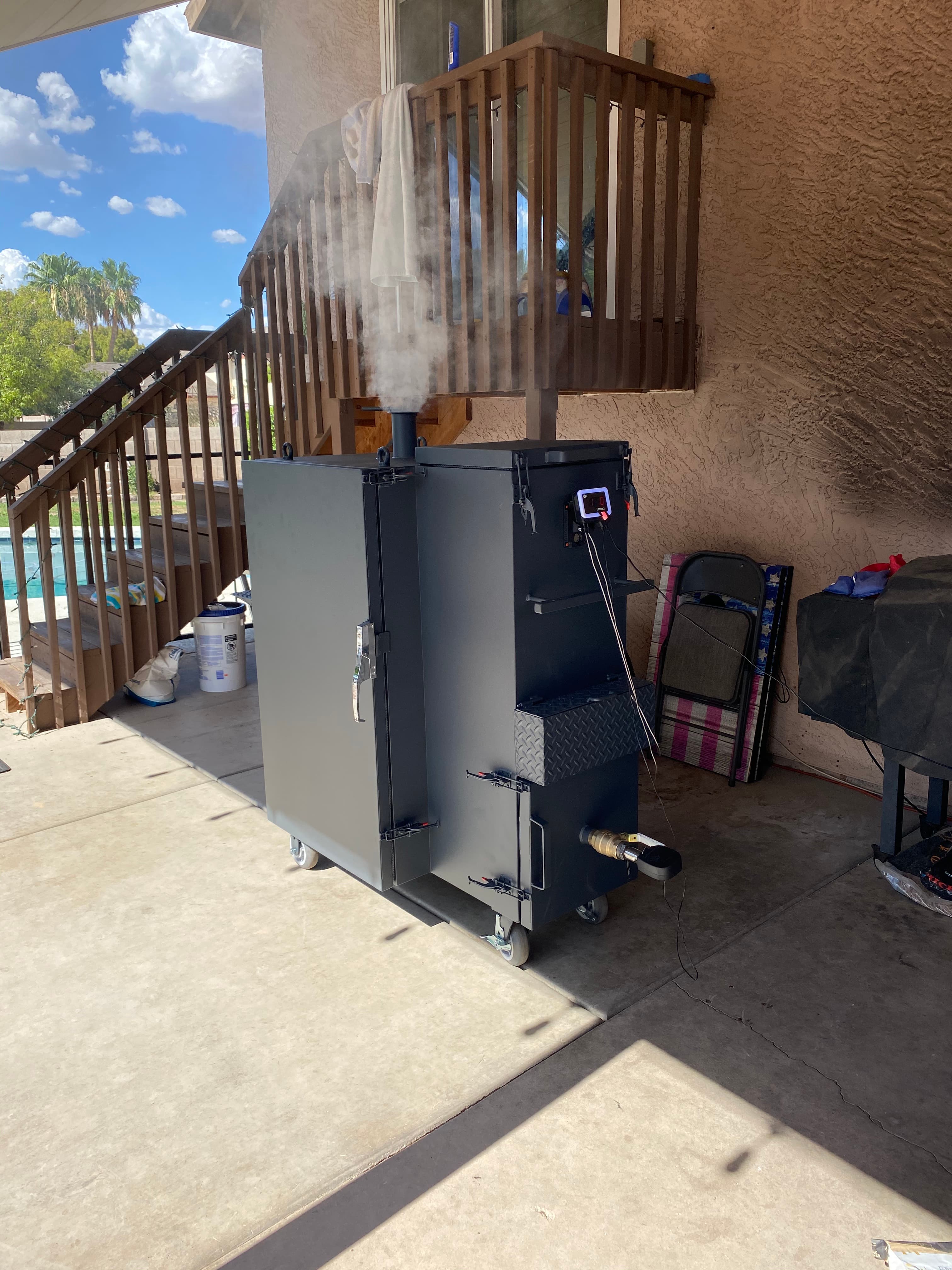 Custom smoker with side firebox design, in action