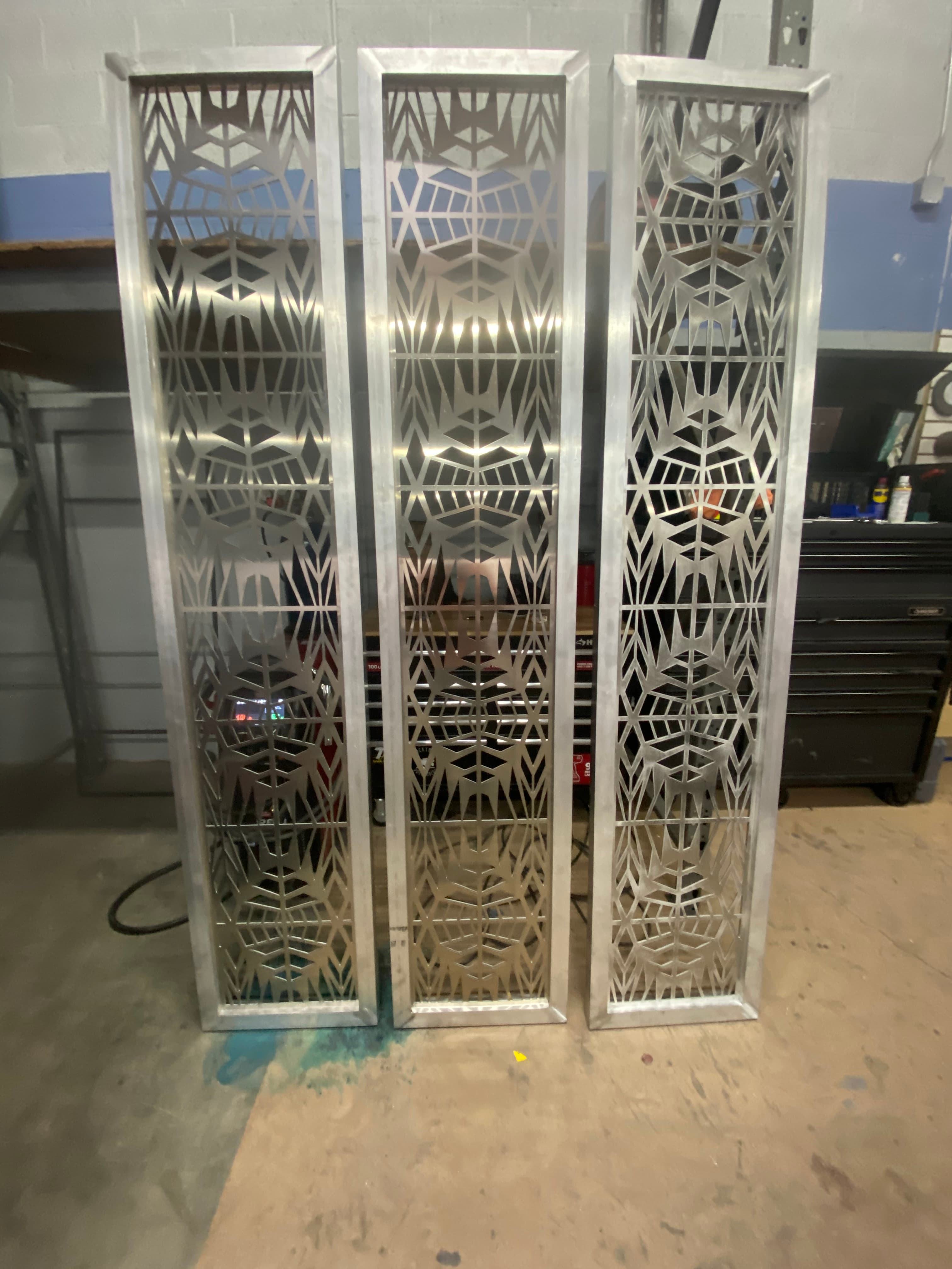 Custom metal panel with brushed finish and cut pattern