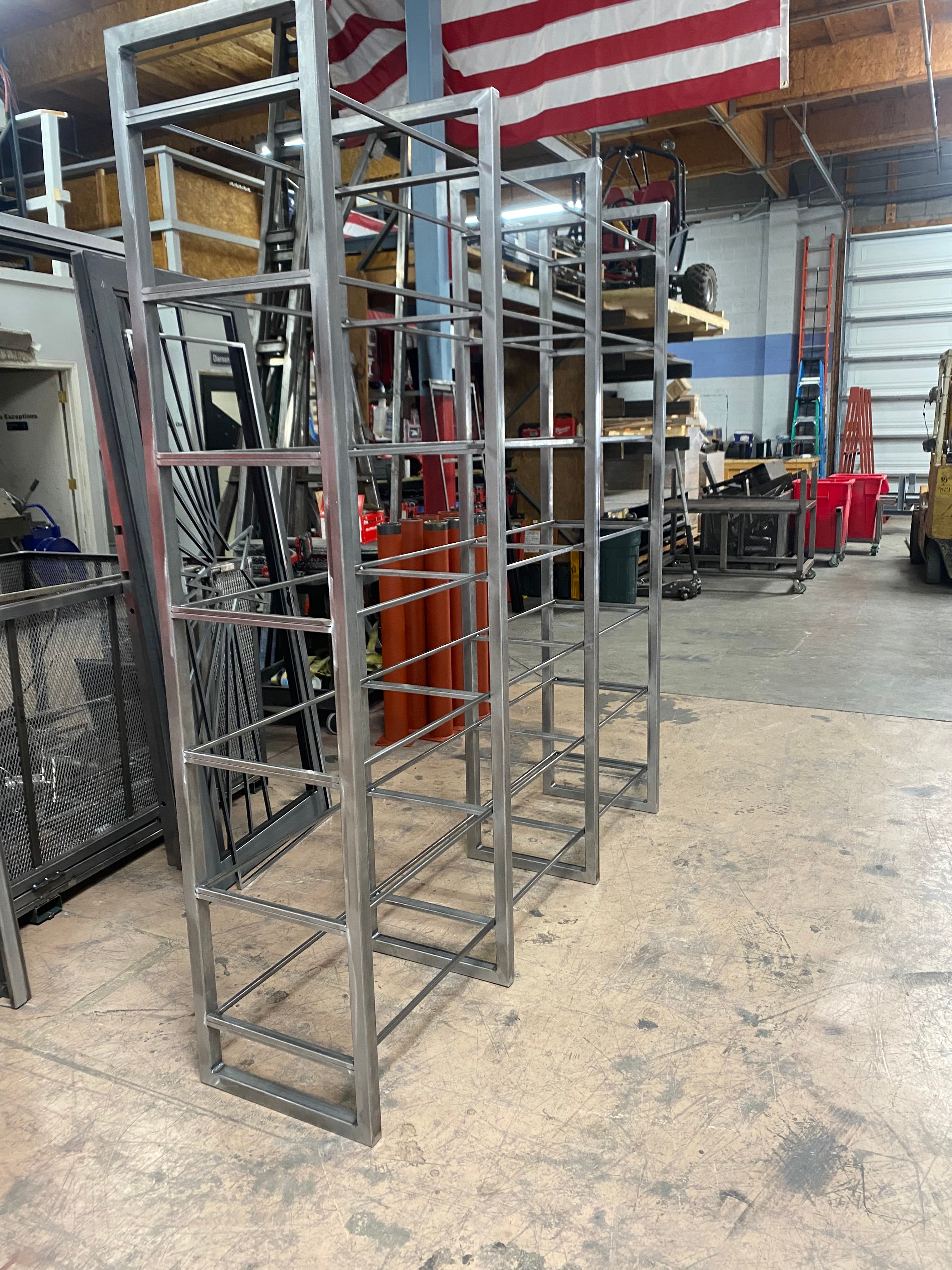 Custom metal wall feature with integrated shelving