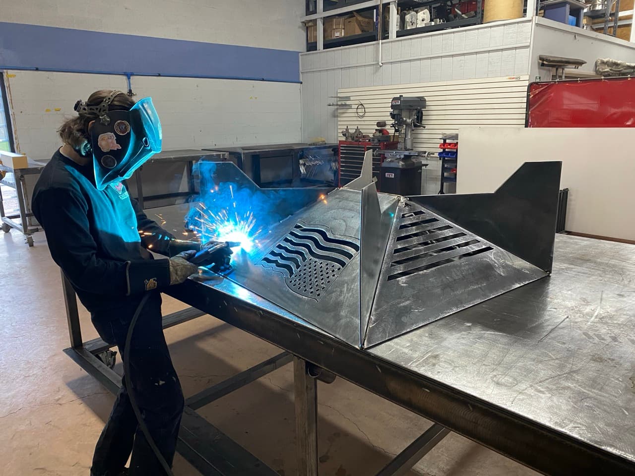 A worker welds together two pieces of metal on one of the projects at Diersen Welding and Fabrication